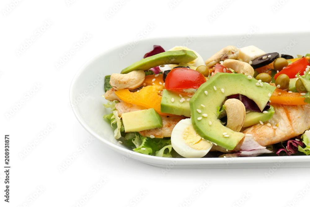 Plate of tasty salad with ripe avocado on white background