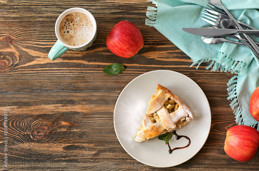 Composition with tasty homemade apple pie on wooden background