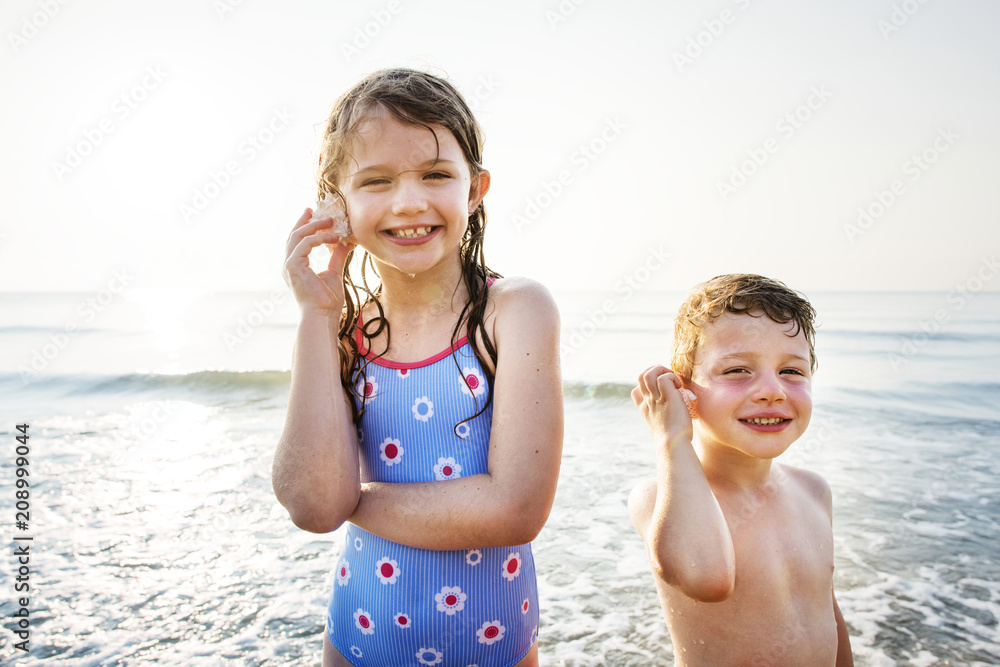 Brother and sister enjoying the beach