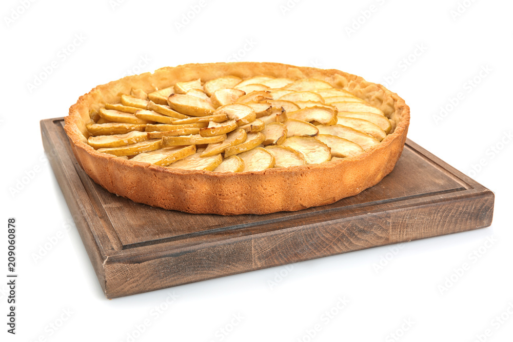 Wooden board with tasty homemade apple pie on white background