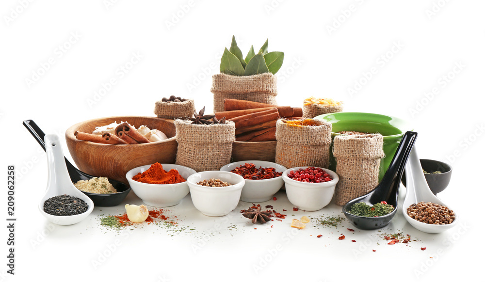 Composition with different spices on white background