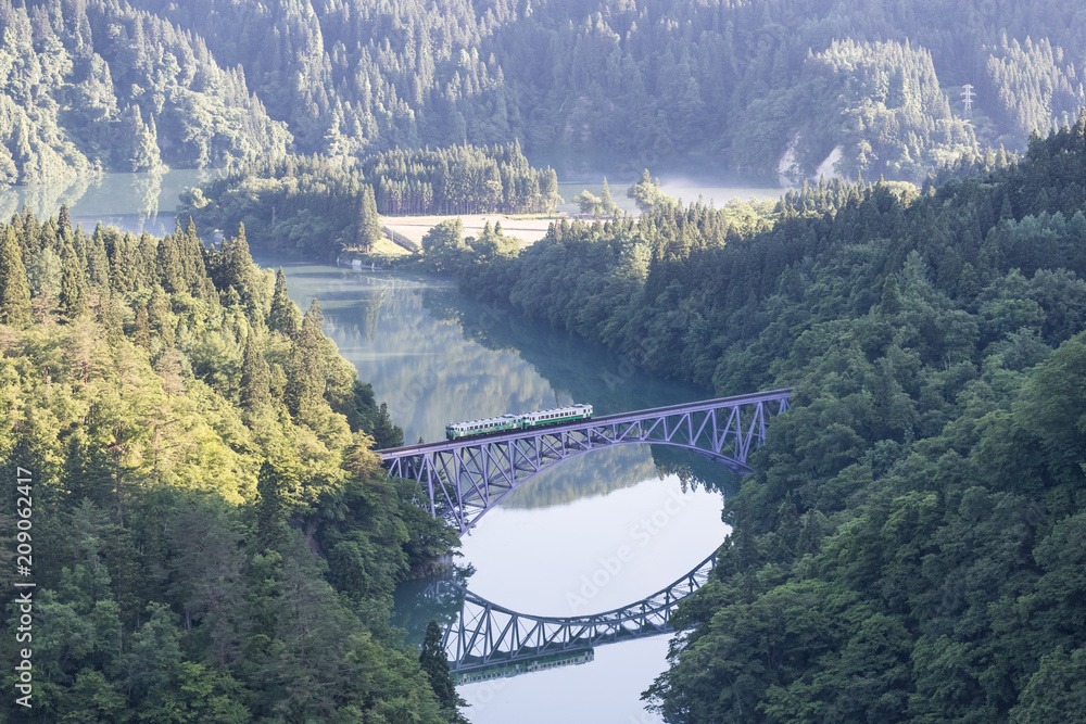 Fukushima, JAPAN - June 17 : The local train Tadami line and Tadami river on June 17 , 2017 in Fukus