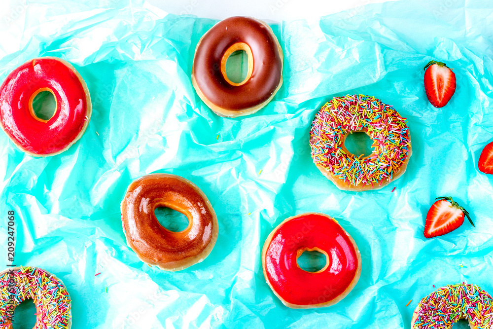 food design with strawberry donat on blue paper background top v