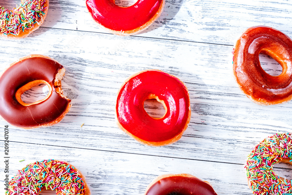 food design with donat set on table background top view pattern