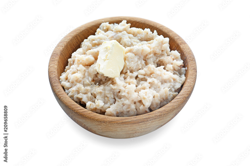 Tasty oatmeal in bowl on white background