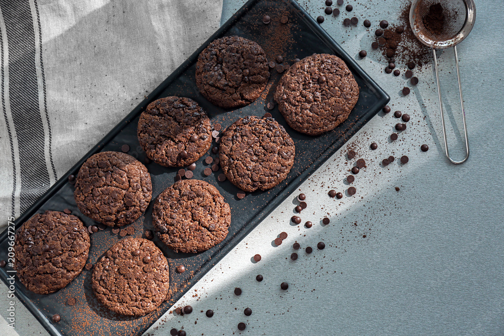 Plate with delicious cookies on table