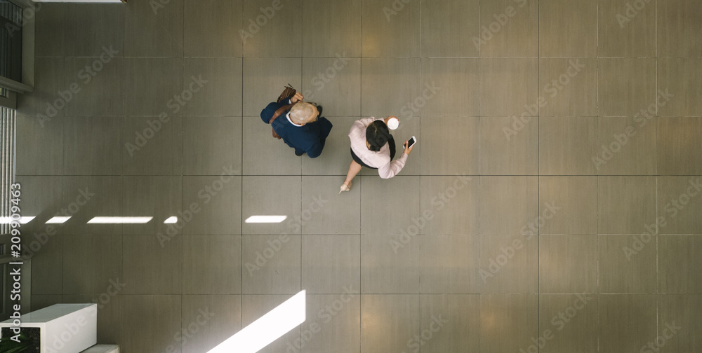 Business people walking together in lobby