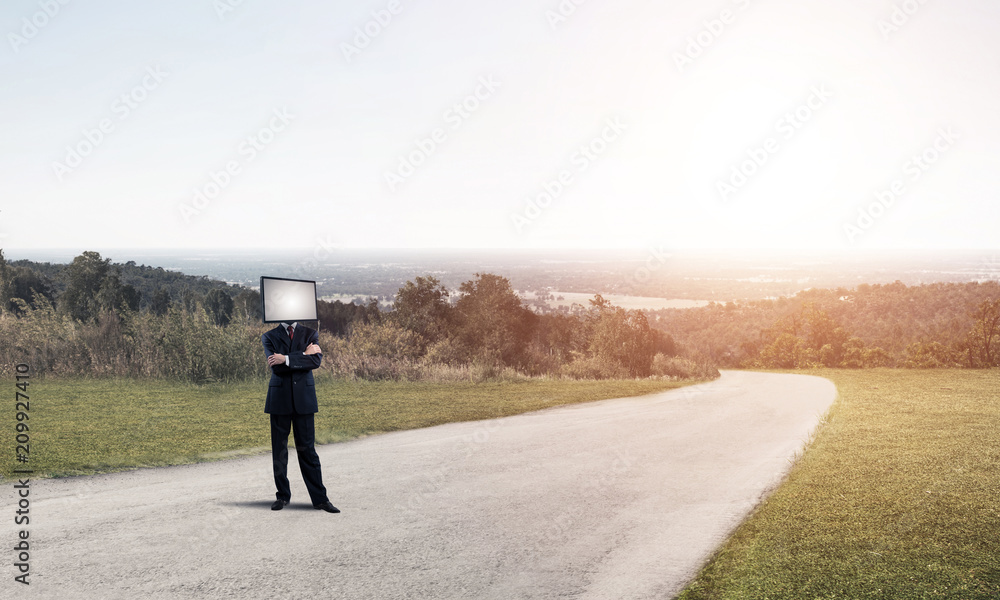 Businessman with TV instead of head.