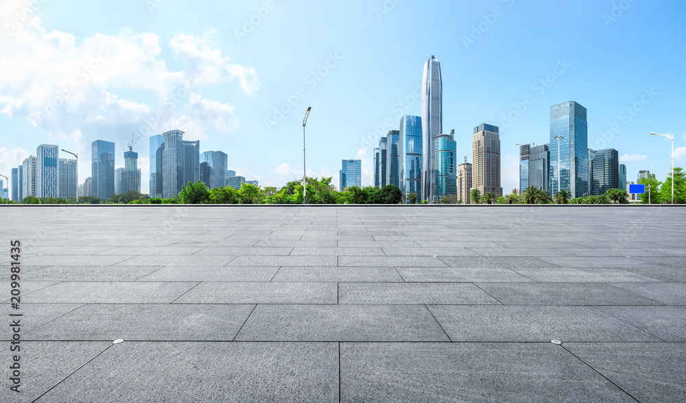 Empty square floor and modern city commercial architecture panorama in shenzhen,China