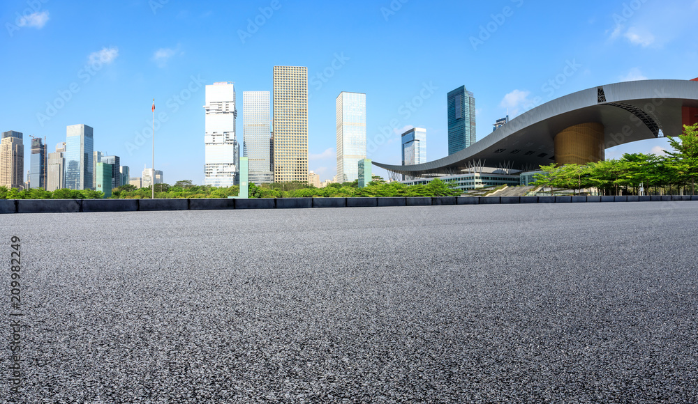 Empty asphalt road and modern city commercial buildings panorama in shenzhen,China