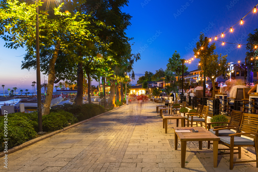 Promenade at the harbour in Side at night, Turkey