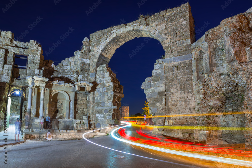 Vespasian gate to the ancient city of Side at night, Turkey