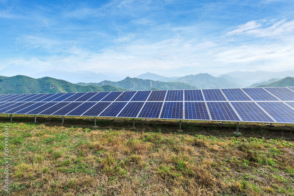 Solar panels and mountains landscape