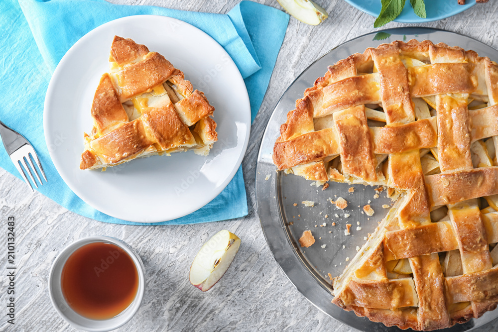 Composition with delicious apple pie on wooden background, top view