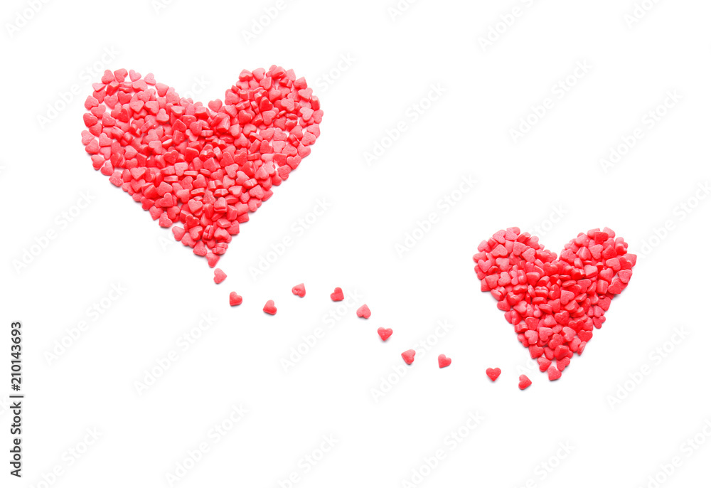 Hearts made of sweet candies on white background