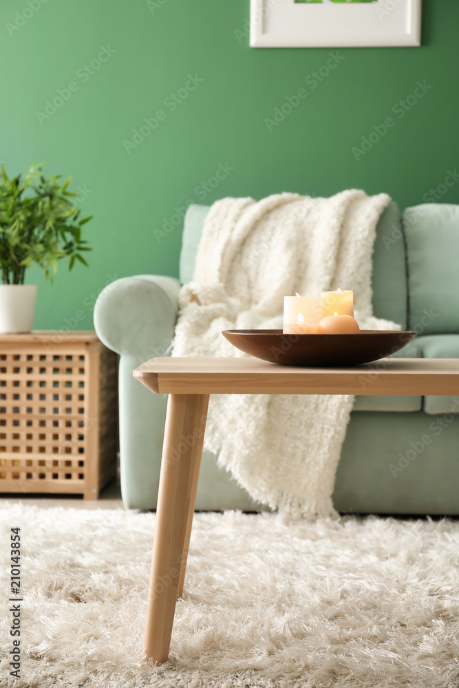 Interior of living room with burning candles