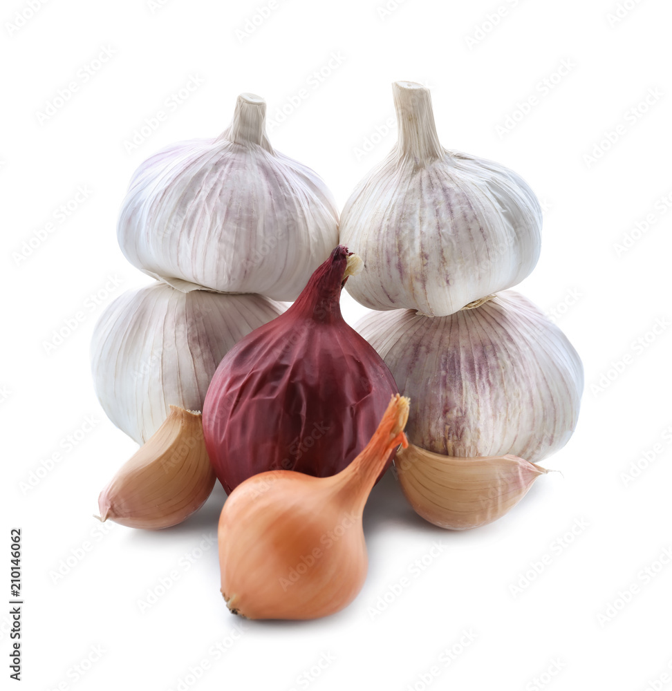 Fresh onions and garlic on white background