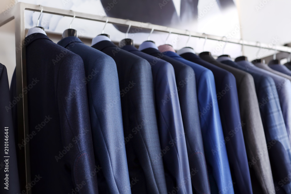 Rack with male clothes in boutique