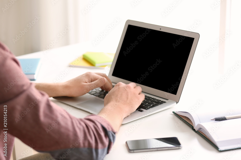 Freelancer working with laptop at home