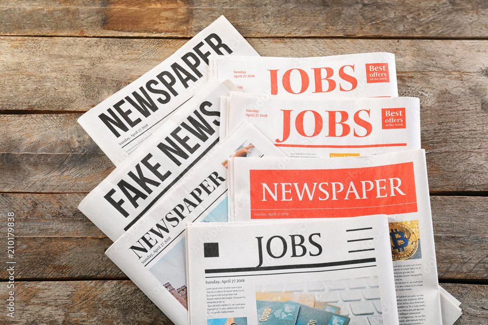 Newspapers on wooden background