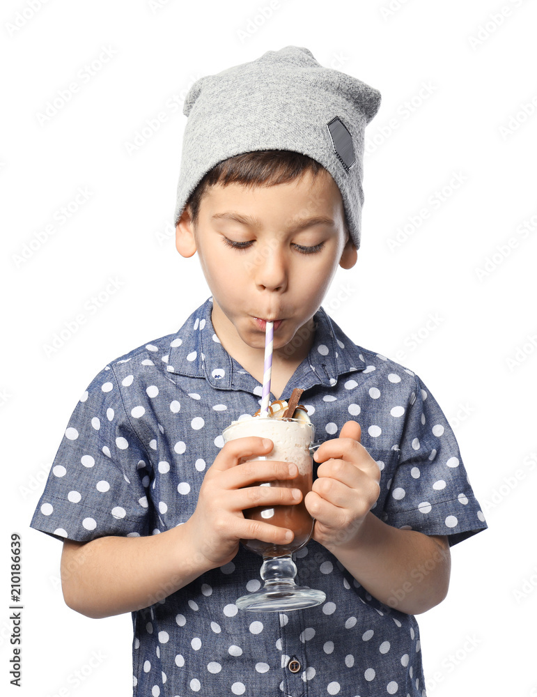 Cute little boy with cup of hot cocoa drink on white background