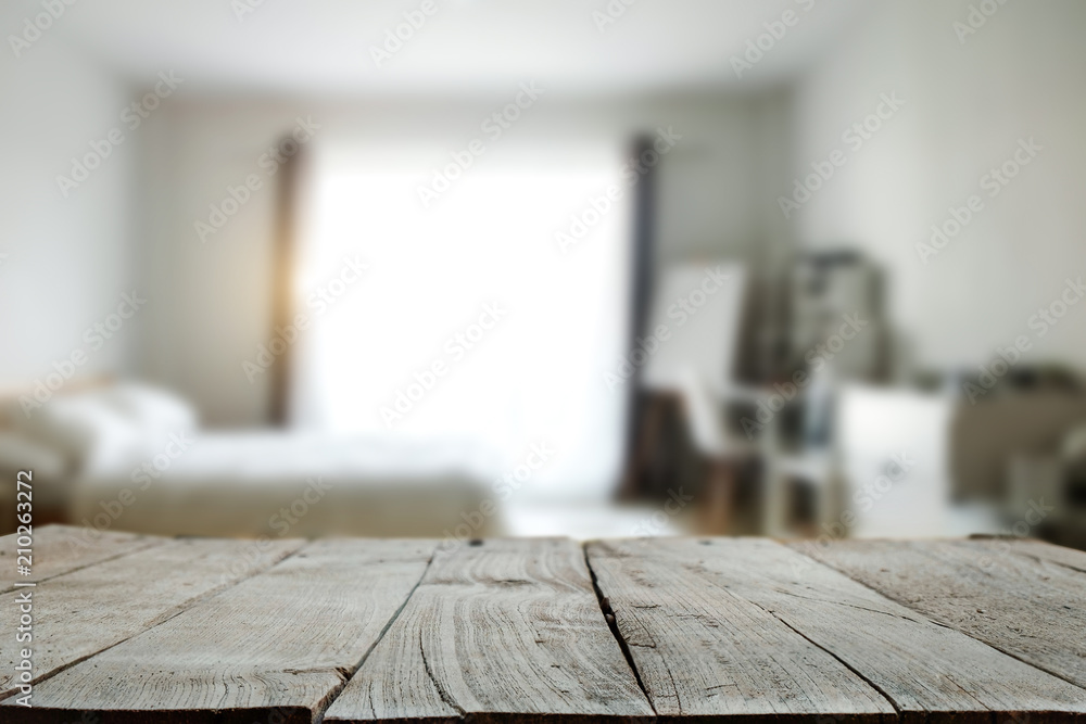 Wood top table with white blurred bathroom interior Background. for product display montage.