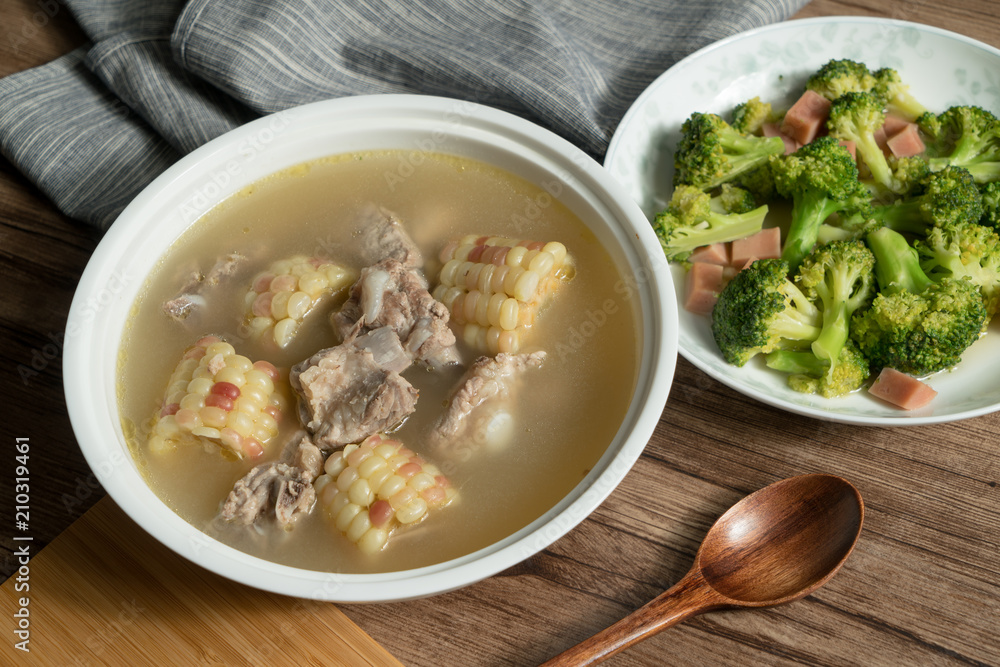 Bone soup with wood grain background