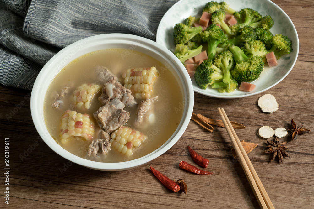 Bone soup with wood grain background