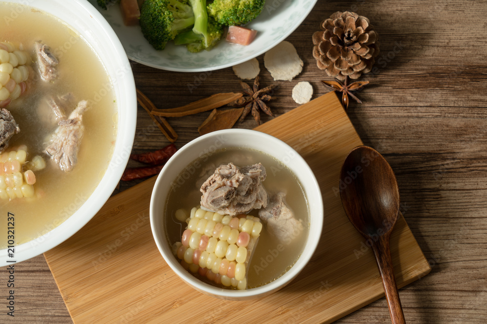 Bone soup with wood grain background