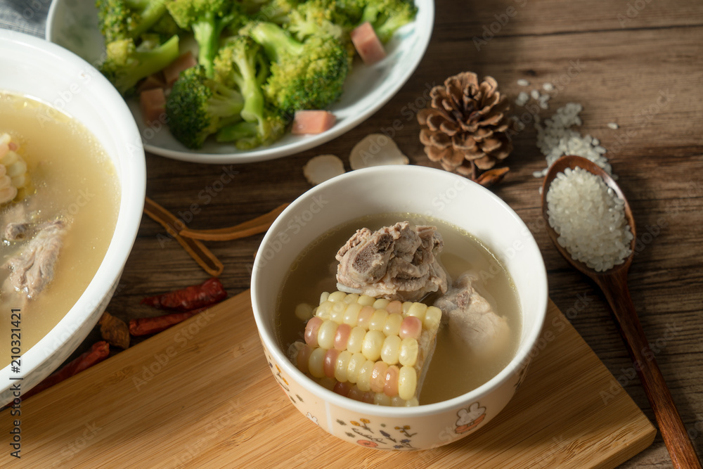 Bone soup with wood grain background