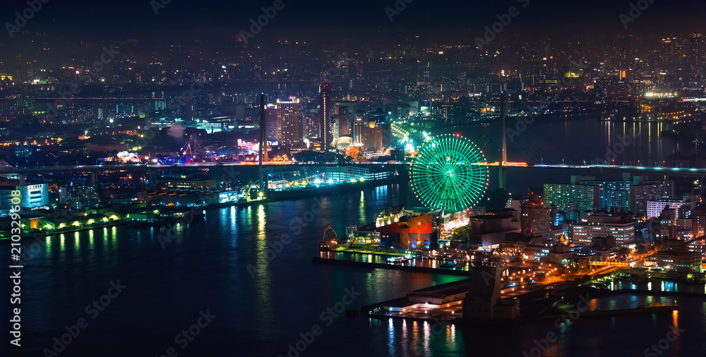 Aerial view of the Osaka Bay harbor area with the ferris wheel at night