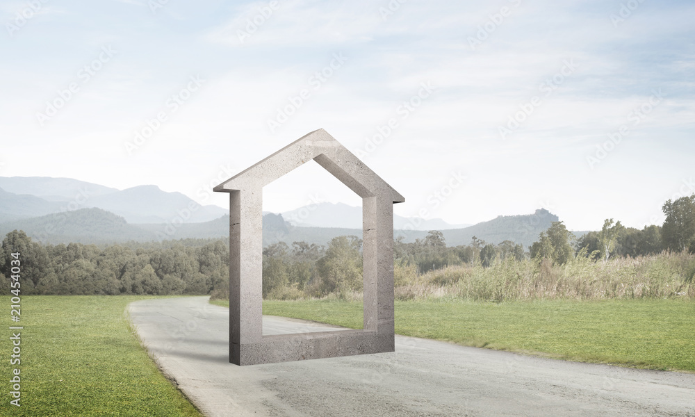 Conceptual background image of concrete home sign on asphalt road