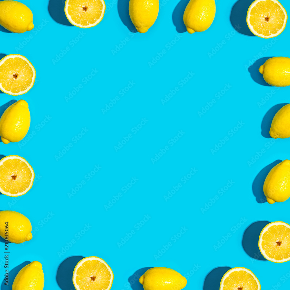 Fresh lemon pattern on a vivid blue background flat lay