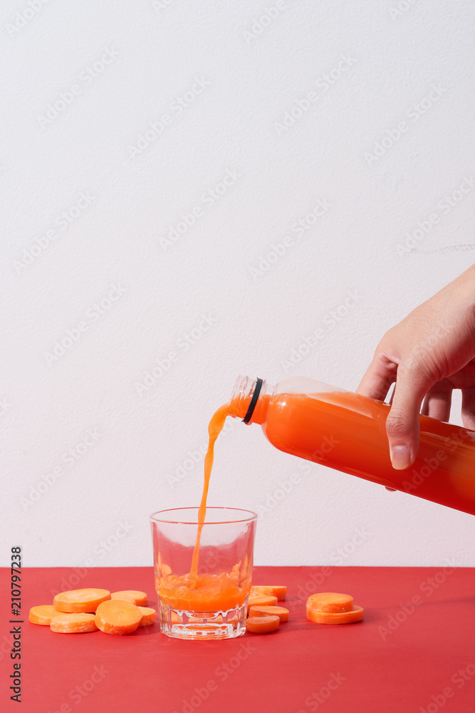 Fresh natural carrot juice on table. Healthy drink.