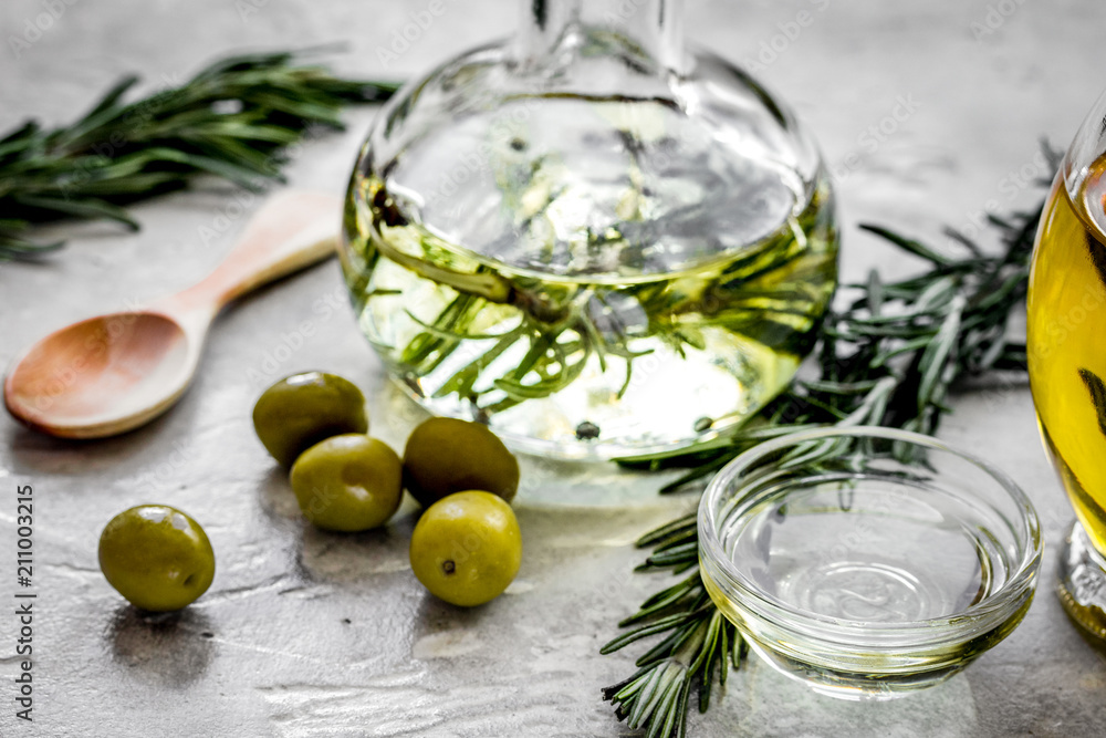 olive oil with ingredients on kitchen table background