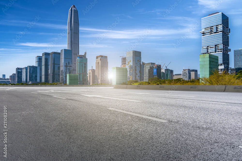 empty road with panoramic cityscape