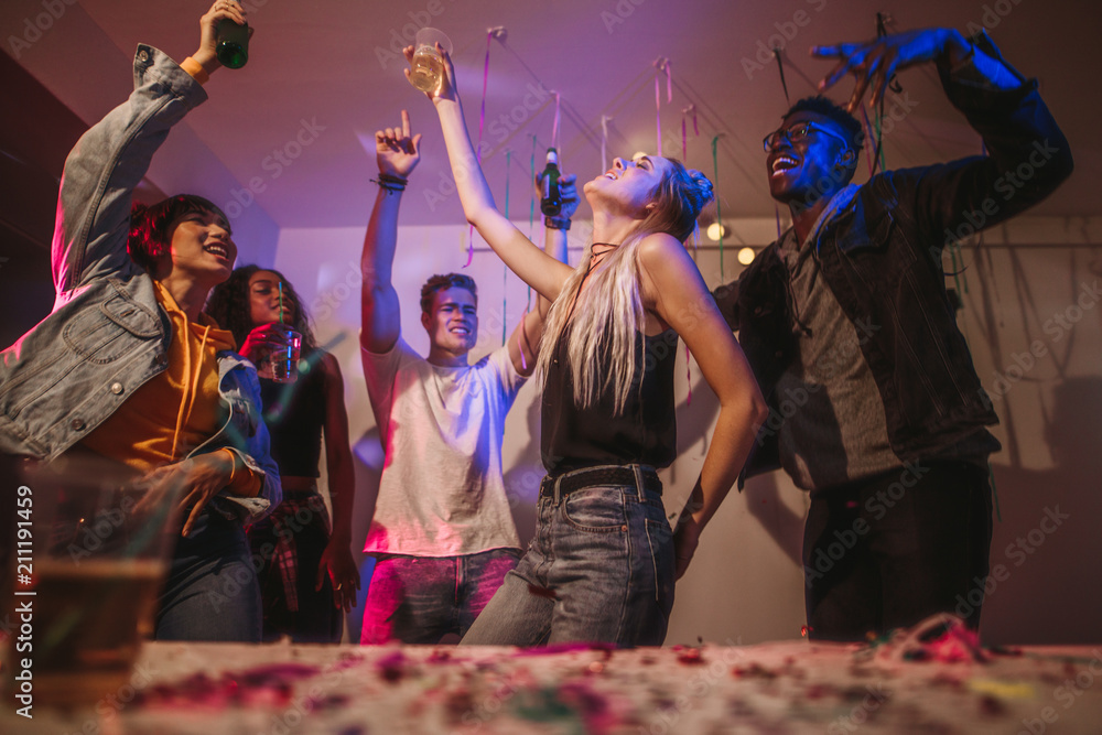 Friends dancing at a house party