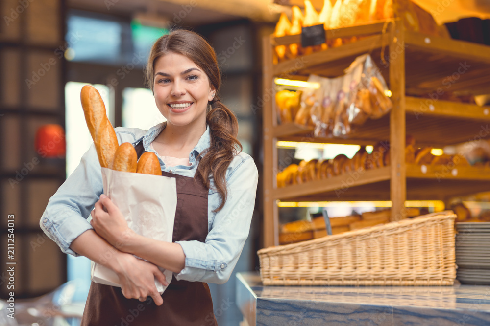 Young woman with baguettes