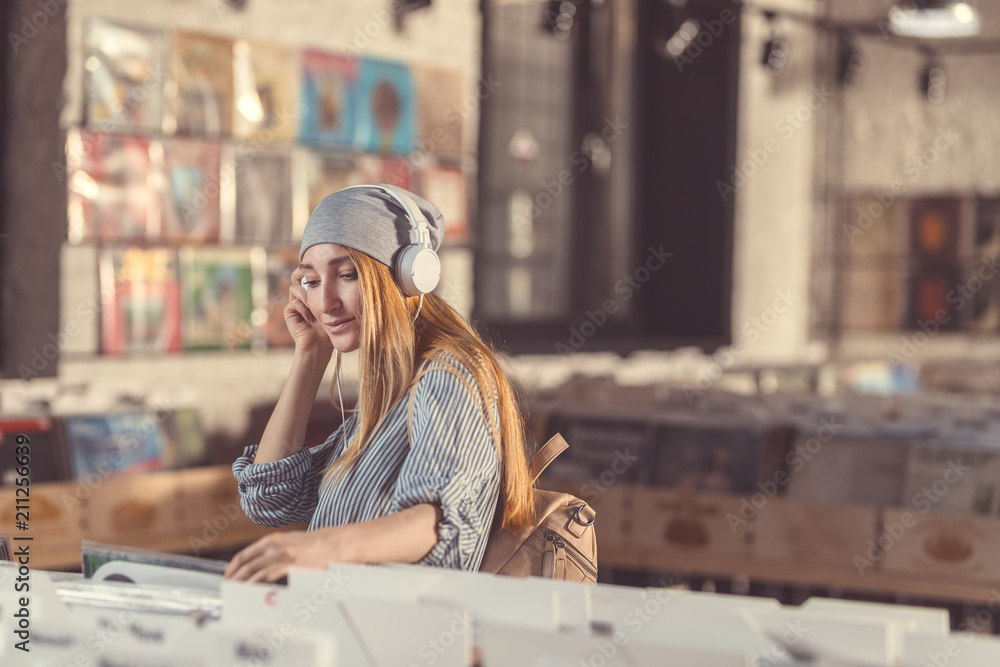 Young girl listening to music on headphones