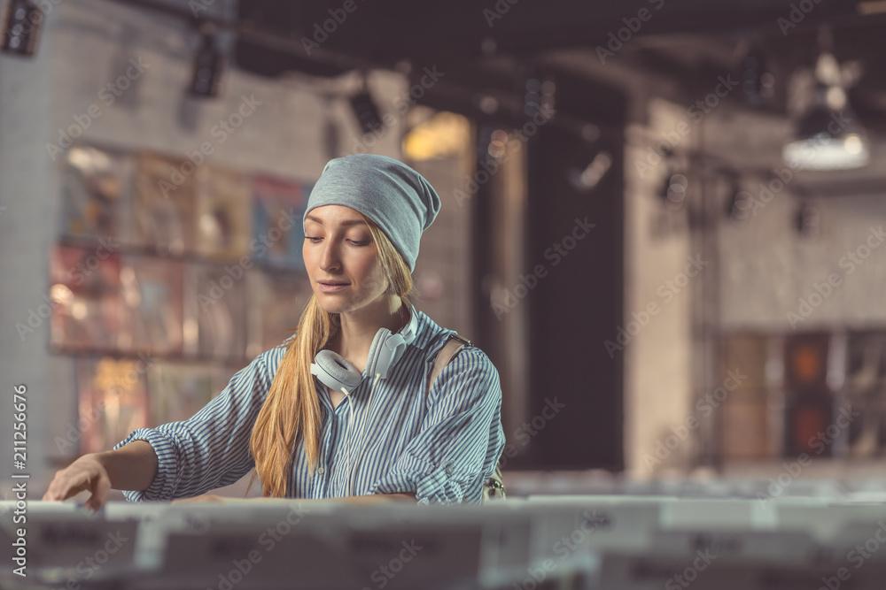 Attractive girl in a music store