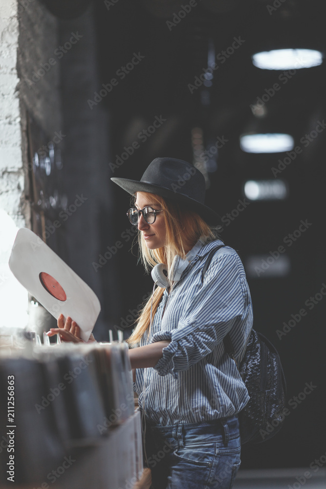 Young girl with a record indoors