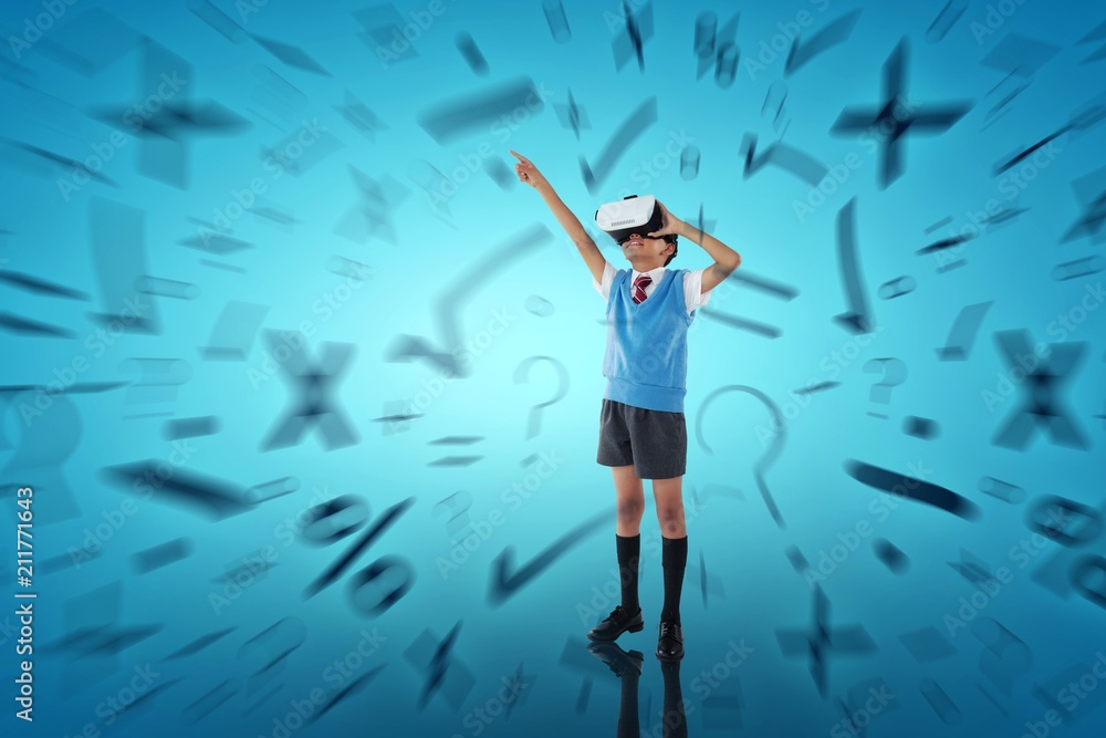 Composite image of full length of school boy wearing vr headset