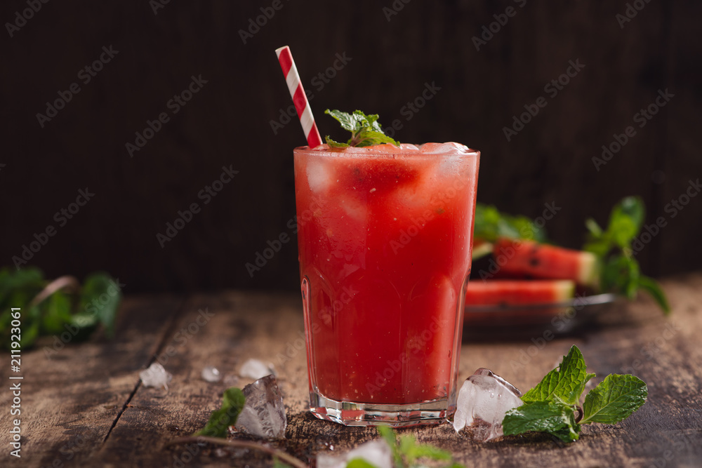 Refreshing summer watermelon juice in glasses with slices of watermelon