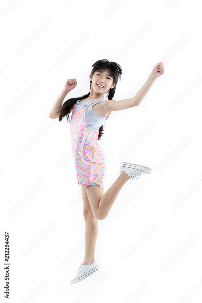 Portrait of Happy Asian child girl jumping and smiling isolated on white background