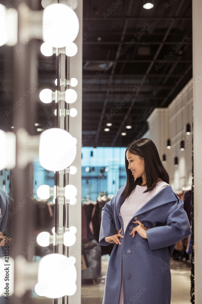 Young beautiful woman in a store