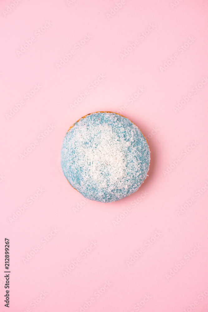 Donuts with icing on pastel pink background with copyspace. Sweet donuts.