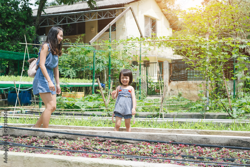 Mother and daughter engaged in gardening together