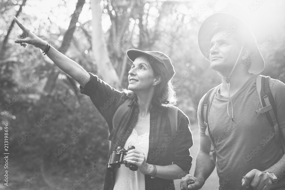 Couple trekking together in the forest