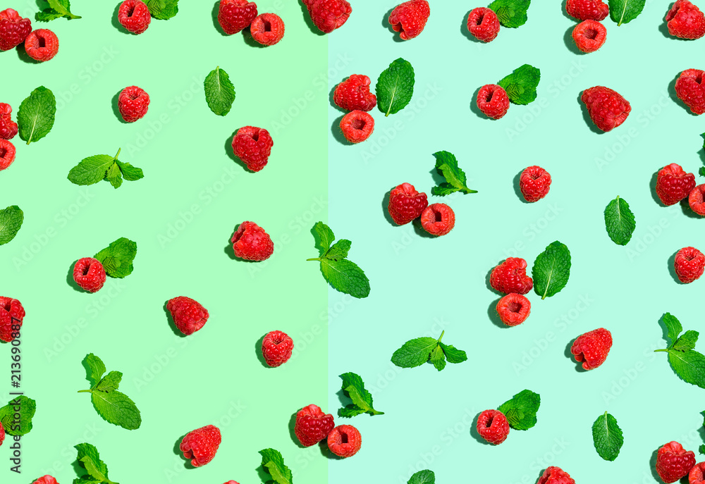 Raspberries and mints on a solid color background