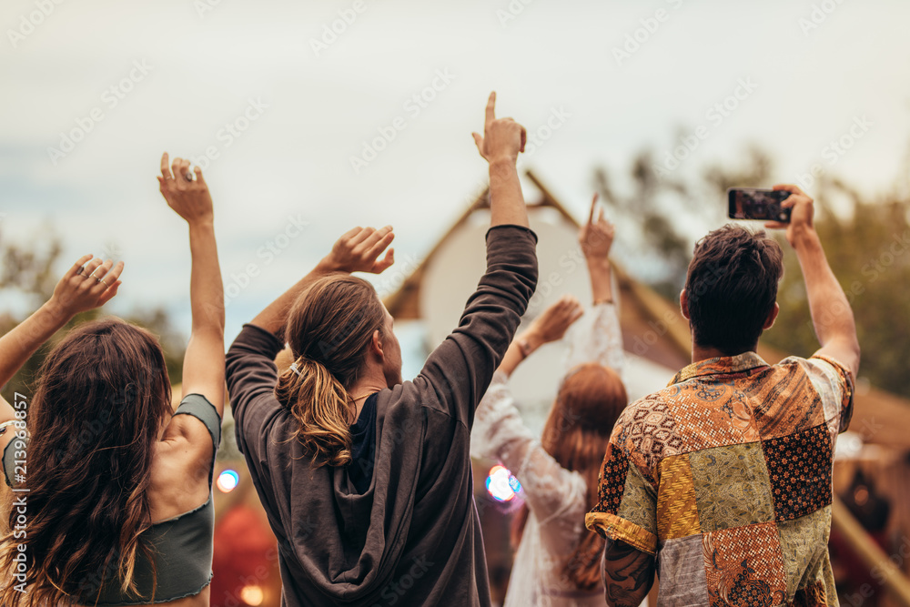 Young people enjoying at music concert